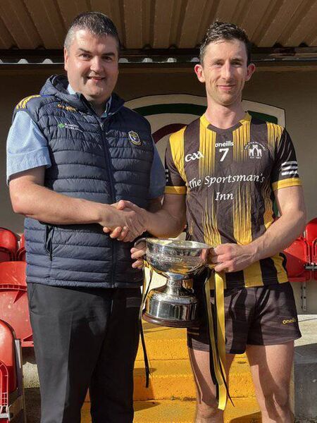Roscommon GAA Chairperson, Brian Carroll, presents the Jamesie Murray Cup to Strokestown captain, Colin Compton. Picture: Roscommon GAA Roscommon GAA Chairperson, Brian Carroll, presents the Jamesie Murray Cup to Strokestown captain, Colin Compton. Picture: Roscommon GAA