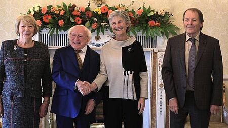 Hugs and handshakes as President Higgins welcomes his successor