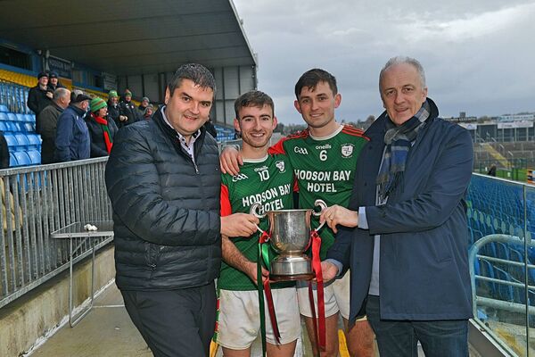 Joint St. Brigid's captains, Paul McGrath and Brian Stack, receive the Fahey Cup from Roscommon GAA Chairperson, Brian Carroll, and Tim Hayes, Managing Director, Hodson Bay Hotel, following their side's four-point victory against Pádraig Pearses at King and Moffatt Dr. Hyde Park on Saturday last. Pictures: Gerard O'Loughlin Joint St. Brigid's captains, Paul McGrath and Brian Stack, receive the Fahey Cup from Roscommon GAA Chairperson, Brian Carroll, and Tim Hayes, Managing Director, Hodson Bay Hotel, following their side's four-point victory against Pádraig Pearses at King and Moffatt Dr. Hyde Park on Saturday last. Pictures: Gerard O'Loughlin