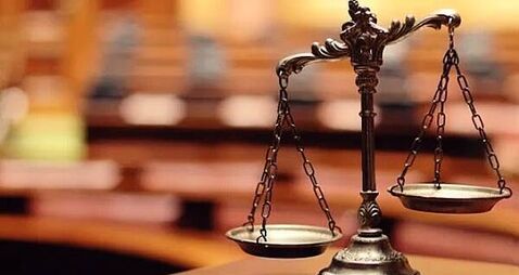 Man has assault conviction for spitting on neighbour overturned