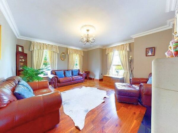 The property has a living room with natural limestone fireplace together an elegant sitting room to the front.