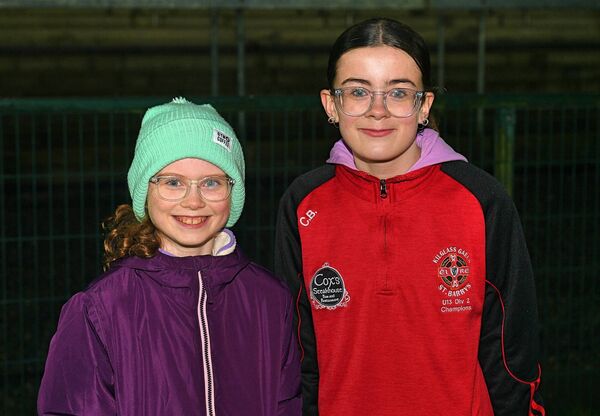 Saoirse and Erin Burke supporting the Kilglass Gaels/St. Barry's U-20 footballers during their championship success against Tulsk in Strokestown on Saturday evening. Picture: Gerard O'Loughlin