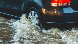 <p>The car got stuck in floodwaters. Pic: iStock</p>