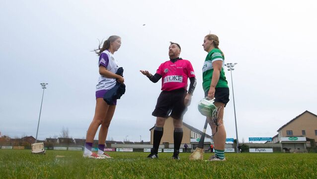 <p>St. Dominic's captain Niamh Watson with her Brídíní Óga counterpart, Torie Edgar, and referee Simon Redmond during the coin toss ahead of last Saturday's All-Ireland junior club camogie final at Donaghmore Ashbourne GAA grounds. Picture: INPHO/Leah Scholes</p>