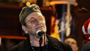 Bono joins annual Dublin city centre Christmas Eve busking session