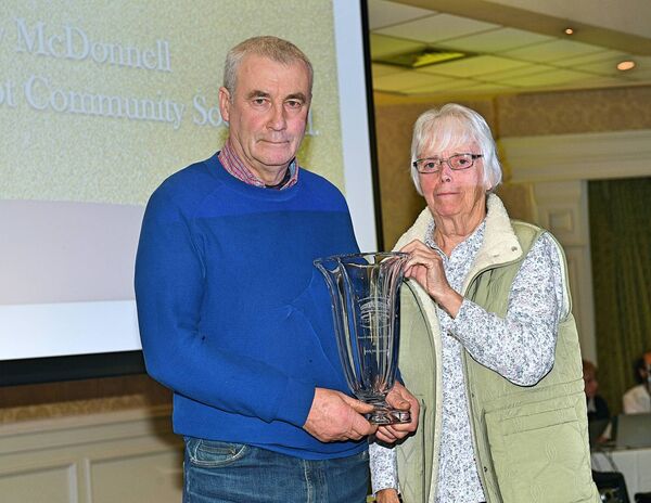 Andy McDonnell, winner of the Voluntary Board member of the Year Award is presented with his award by Margaret Mulligan. Pic: Gerard O'Loughlin