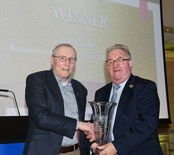 Joe Nally of the Roscommon Drama group won the Community Cause Champion category. he is pictured being presented with his award by Bernie Kearney. Pic: Gerard O'Loughlin