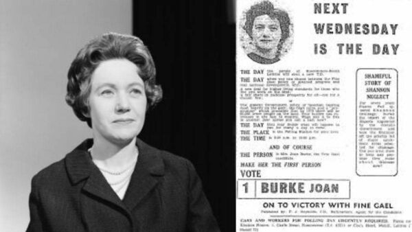 Joan Burke alongside an election campaign poster