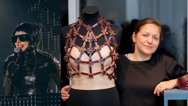 Una Burke with Lady Gaga in one of her leather creations