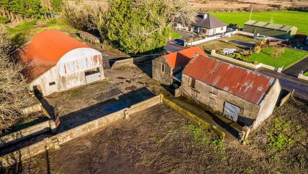 The holding comprises a selection of traditional outbuildings and agricultural structures. 