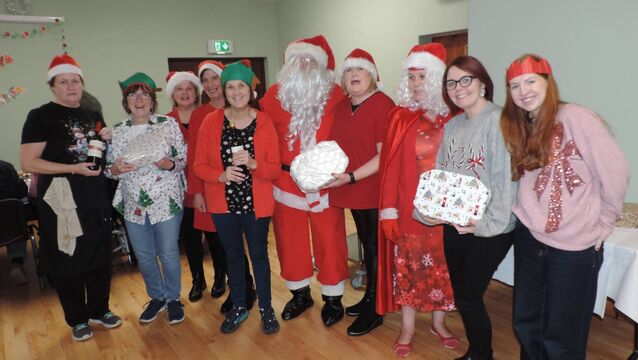 <p>The management and staff of Kilmovee Community Centre with Santa and Mrs Claus at the Kilmovee Active Age Christmas party. Pic: James Hunt Photography </p>