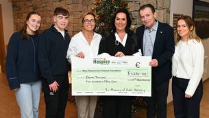 <p>Pictured presenting the cheque to Martina Jennings, CEO Mayo Roscommon Hospice Foundation, is Liza along with Edel’s husband Paul and their children Eva,Ellen &amp; Tom. Pic: Gerard O’Loughlin. </p>