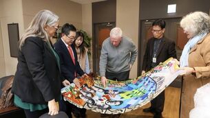 <p>The tapestry features the seven Columban Martyrs, the Korea national flower-Hibiscus Siriacus and a Celtic Cross. </p>