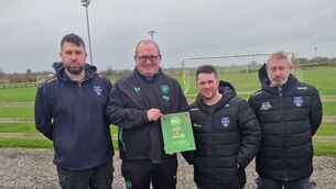 <p>Roscommon FAI Development Officer, Damon Kearney, presents Cloonfad United's Mark Cunniffe, Jack Harrington and Darragh McDonnell with the club’s One Star Club Mark Award. Picture: Cloonfad United</p>