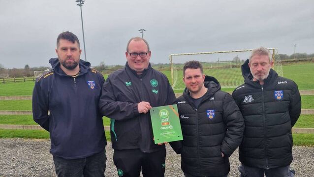 <p>Roscommon FAI Development Officer, Damon Kearney, presents Cloonfad United's Mark Cunniffe, Jack Harrington and Darragh McDonnell with the club’s One Star Club Mark Award. Picture: Cloonfad United</p>