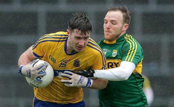 Roscommon forward Cathal Cregg is tackled by Kerry's Darran O'Sullivan during the Division One Football League meeting between the teams in early February 2016. Picture: INPHO/Morgan Treacy