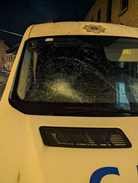 A garda van with a damaged windscreen.