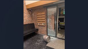 <p>The front door window of the Garda station shattered with a strewn beer keg nearby.</p> <p>The front door window of the Garda station shattered with a strewn beer keg nearby.</p>