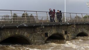 <p>27-01-2025. School students make their way home over Nineteen arches bridge in Arklow, Co Wicklow which comes under pressure from a heavy river surge in Arklow, Co Wicklow. Photograph: Garry O'Neill.</p> <p>27-01-2025. School students make their way home over Nineteen arches bridge in Arklow, Co Wicklow which comes under pressure from a heavy river surge in Arklow, Co Wicklow. Photograph: Garry O'Neill.</p>