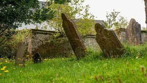 Storm damaged grave stones yet to be repaired