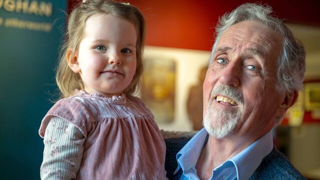 <p>Holly Folan with her grandfather at the opening of the exhibition ‘Maiden, Mother, Saint,’ as part of the 2026 St. Brigid's Day Festival at Rathcroghan Visitor Centre, Tulsk. Pic. Breda Durr </p>