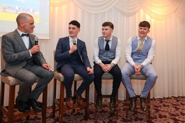 MC Willie Hegarty in conversation with 2025 Roscommon minor footballers, Dara Curran, Dean Casey and Shay McGuinness, at the presentation of Connacht medals to the panel in the Abbey Hotel on Friday evening. Picture: Bernie O'Farrell