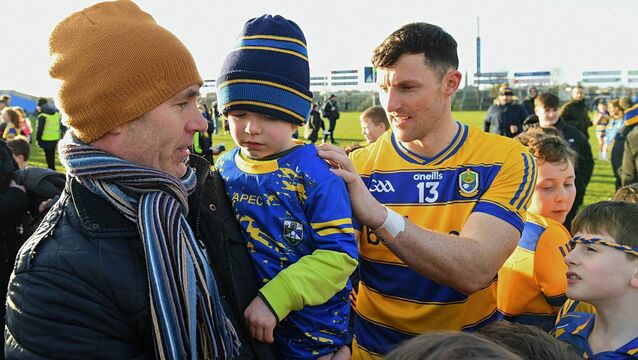 <p>SIGN HERE: Roscommon senior football captain, Diarmuid Murtagh, signs Senan Cunniffe’s top, pictured here with his father Alan, following the Rossies' six-point victory against Monaghan at King and Moffatt Dr. Hyde Park on Sunday last. Picture: Gerard O'Loughlin</p>