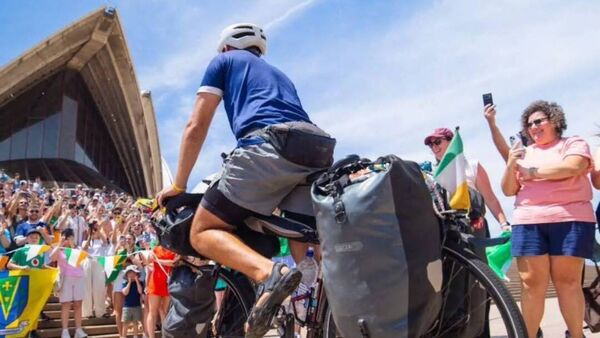 Watch: Large crowds celebrate at Sydney Opera House to mark end of Roscommon man’s global cycle 