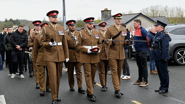 Colleagues of Captain Gilbert Muldowney march to St. Attracta's Church.. Pic: Gerard O'Loughlin