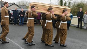 <p>The coffin is carried shoulder high by colleagues to St. Attracta's Church, Ballinameen. Pic: Gerard O'Loughlin</p>