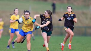 <p>Abby Curran protects possession from Duana Coleman in this afternoon's tussle between Roscommon and Antrim. Picture: Roscommon LGFA.</p>