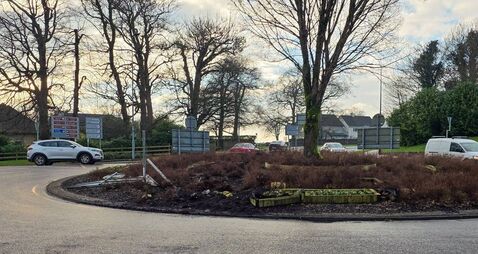 Man arrested following roundabout crash