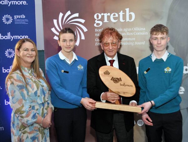 Molly McDermott (Head Girl) and Callum Leech (Head Boy) at Roscommon Community College with principal Georgina Keena presented a plaque to Sean Mulryan, which was made by the students. The presentation was made at the launch of the Ballymore Apprenticeship Bursary. Pic: Liam Reynolds