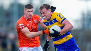 <p>Enda Smith, pictured in action against Armagh's Gareth Murphy, has been selected on the GAA.ie Team of the Week. Picture: INPHO/James Lawlor</p>