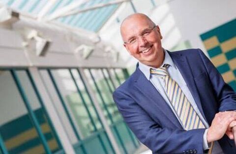 Local professor achieves rare academic milestone