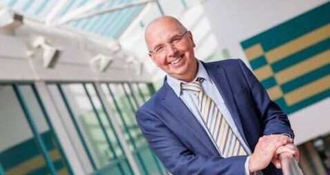 Local professor achieves rare academic milestone