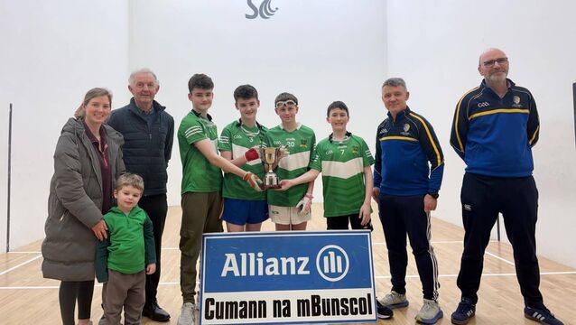 <p>Scoil Bhríde accept the Mary Tully Cup for their great work in promoting handball in the school at the recent Cumann na mBunscol handball finals at St. Coman’s Handball Club. Pictured are Michael Tully, his daughter Siobhán and grandson Jake, Scoil Bhríde players Kian Shanagher, Jamie Shanagher, Jack Gately and Colm Dennigan; Cian Duffy, Cumann na nBunscol Secretary, and Shane O’Donnell, Scoil Bhríde Principal and Cumann na nBunscol committee. </p>