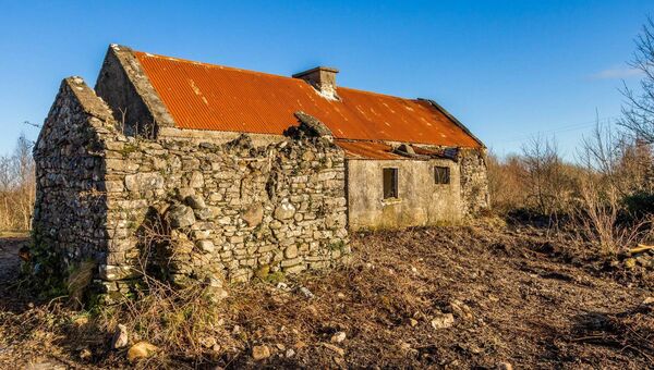 Planning approval is in place for the demolition of the existing derelict cottage.