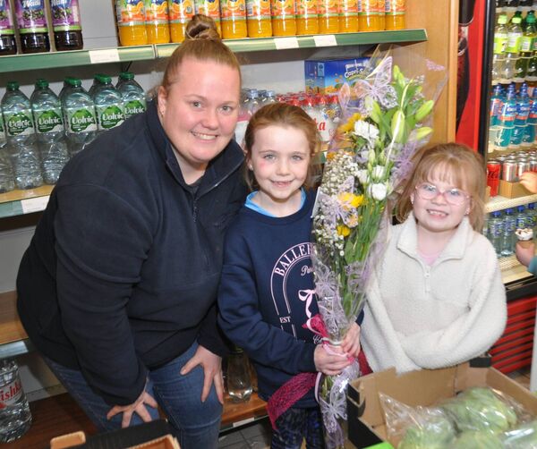 The Egan family came with flowers for Imelda Towey as she retired from business in Ballaghaderreen last weekend. Pic: Liam Reynolds