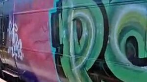 Three train carriages damaged with graffiti