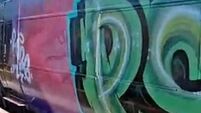 Three train carriages damaged with graffiti 