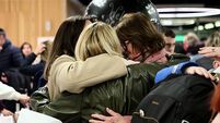 Relieved family reunions at Dublin Airport as chartered flight lands