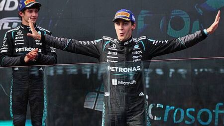 George Russell enjoys ‘hell of a fight’ to win season-opening race in Australia