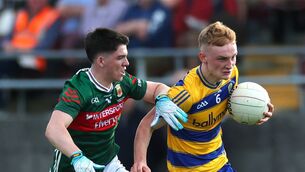 <p>Eoghan Carthy, seen here in action against Mayo's Cathal Keaveney in last year's Connacht final, is this year's Roscommon U-20 football captain. Picture: INPHO/James Crombie</p>