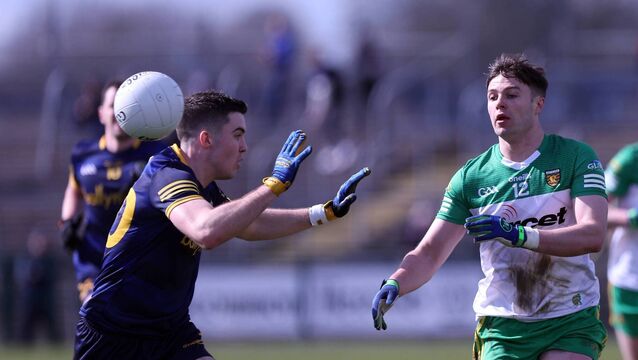 <p>Donegal's Conor O'Donnell and Roscommon's Ruaidhrí Fallon try and win possession for their respective sides during the counties' last league meeting at King and Moffatt Dr. Hyde Park in March 2023. Picture: INPHO/John McVitty</p>
