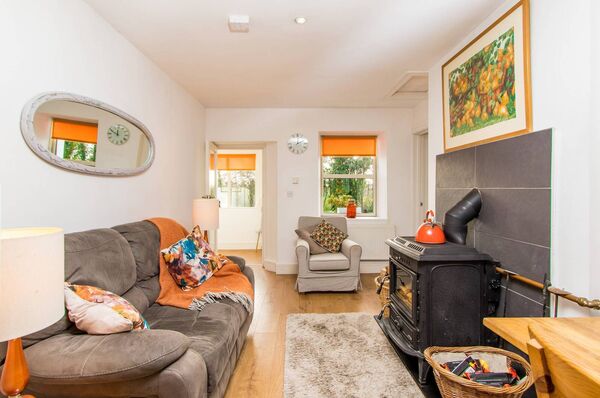 A solid fuel stove provides a cosy focal point.