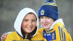 <p>Ruby Dowling and Rosie O’Farrell, Kilbride, supporting the Roscommon senior footballers during their league victory against Donegal at King and Moffatt Dr. Hyde Park on Sunday last. Pictures: Gerard O'Loughlin</p>