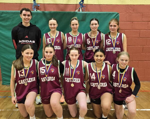 Castlerea Community Games U-16 girls' basketball team county runners up pictured with coach Thomas Callaghan.