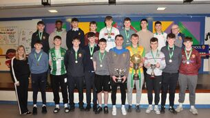 <p>The victorious Castlerea Community School U-19 basketball squad, alongside their coach Tom Callaghan, Castlerea CS Principal Eileen Ryan, and Deputy Principal Jarlath Burke on their triumphant return to the school as All-Ireland champions. Picture: Liam Reynolds</p>