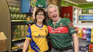 <p>Ryanair chief executive Michael O’Leary paid a brief visit to Ireland West Airport Knock to mark the airport’s 40th anniversary. He is pictured here with Mary McDonnell, a Roscommon supporter who works in the shop at the airport Pic: Michael McLaughlin</p>